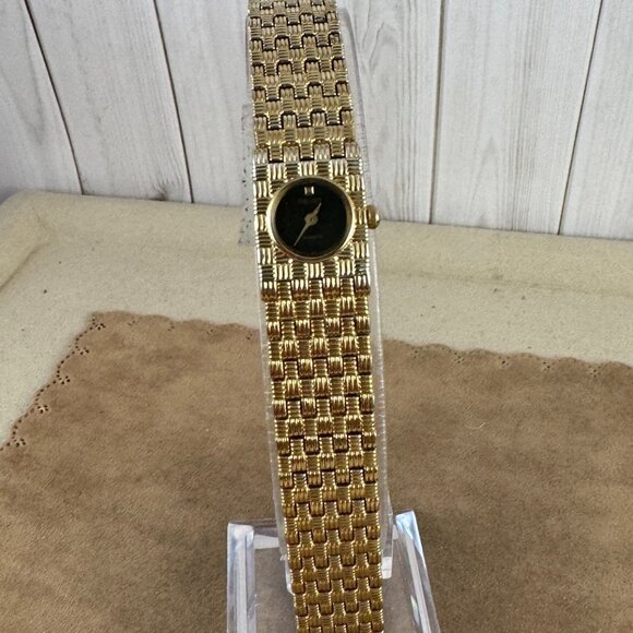 Vintage Seiko watch features an 18K plating and a custom channel link bracelet